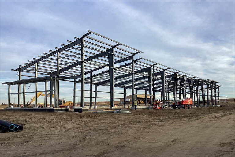 The frame of a CDOT vehicle storage facility being built