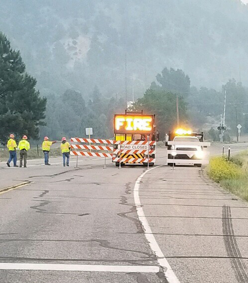 A CDOT maintenance crew moves barriers from the upper CR 250 area to the location of where the train tracks cross US 550 in Hermosa.