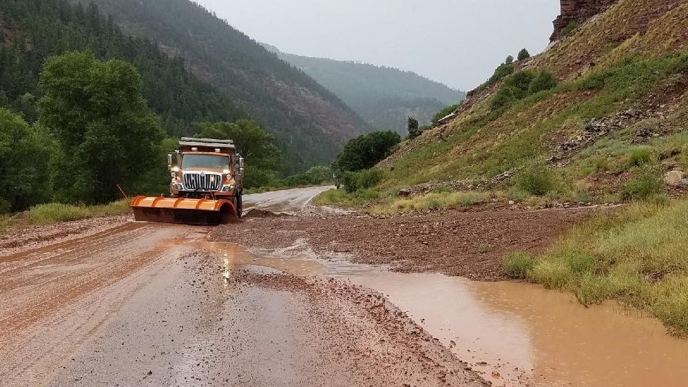 CDOT truck clearing roadway after flooding detail image
