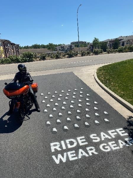 Motorcyclist near the Ride Safe Wear Gear rumble strip detail image