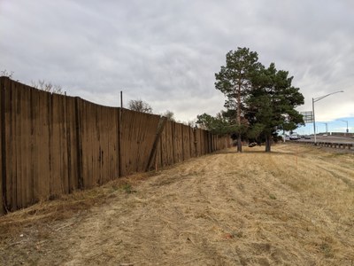 Image of roadside before, with the old timber walls