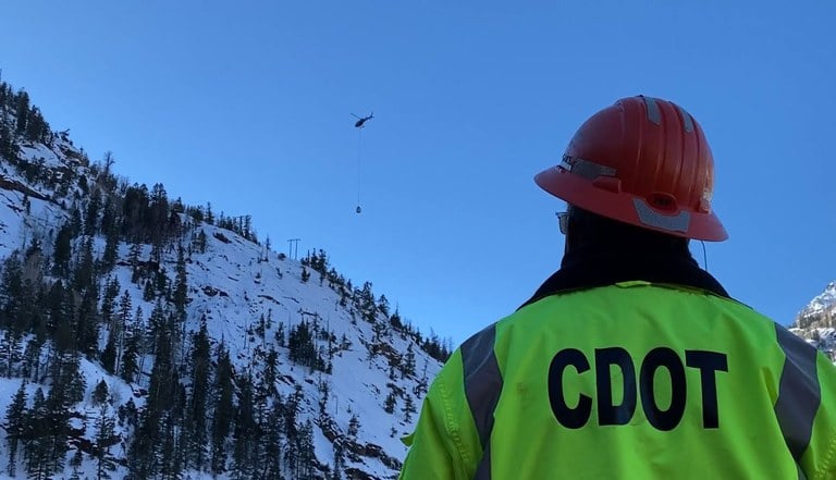 CDOT employee facing US 550 Red Mountain Pass during 2023 winter maintenance