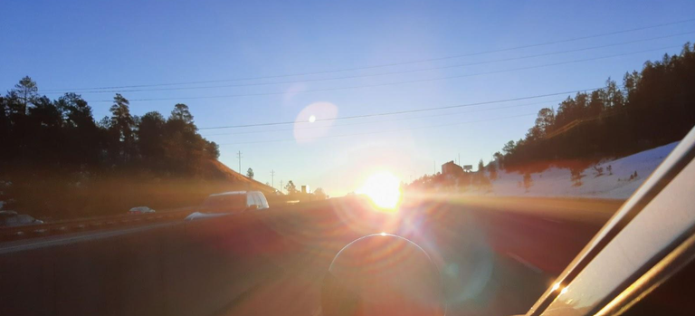 Sun glare along eastbound I-70 near Floyd Hill.