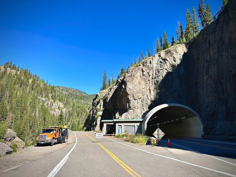 US 160 Wolf Creek tunnel bypass lane located between South Fork and the pass summit with CDOT truck parked on the side of the road