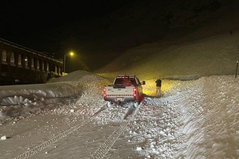 10 feet deep and 100 feet wide avalanche debris covering the Loop Road on the west side of the Eisenhower-Johnson Memorial Tunnel