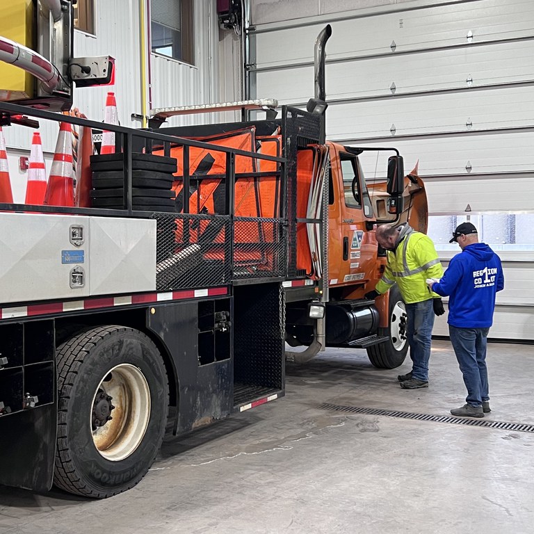 CDL trainers doing snowplow safety checks