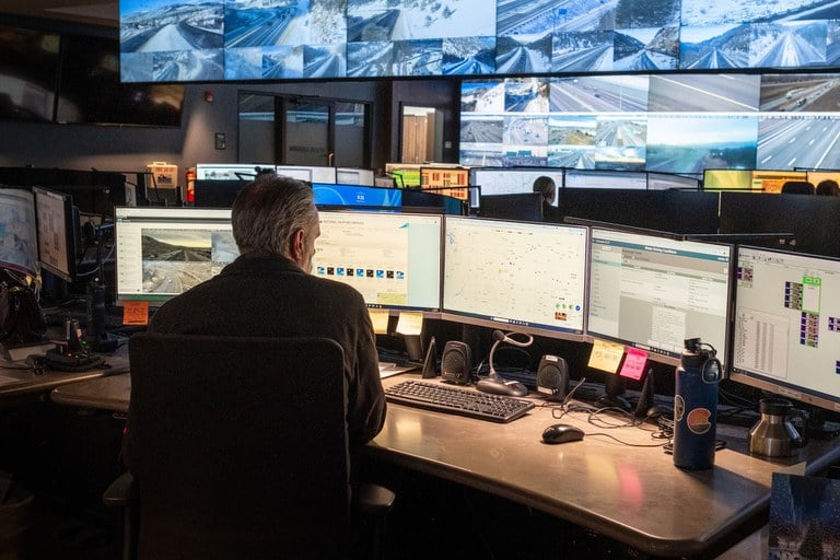 A CDOT employee monitors traffic, roadway incidents and weather at CDOT’s operations center in Golden, CO