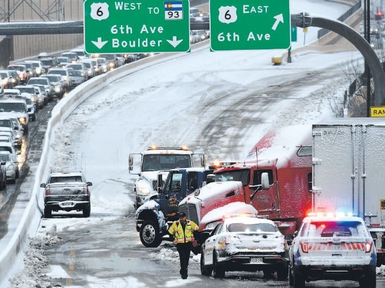 Incident Response Team member tends to a crash on a snowy highway