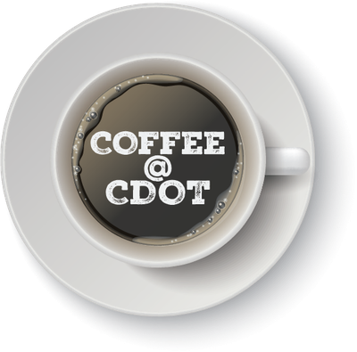 A full coffee mug from above with the words "Coffee @ CDOT" typed in the coffee.