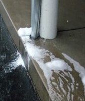 Soap suds or anything with color or odor exiting a storm drain pipe