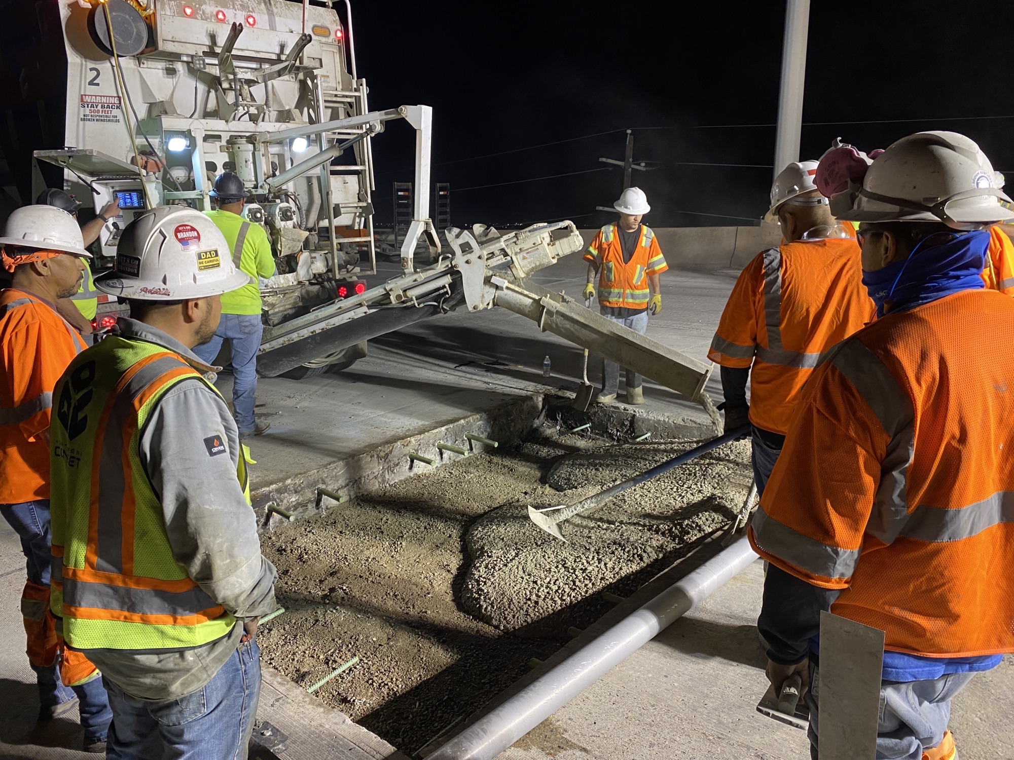 Crews pour new concrete bridge panels detail image