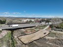 Site preparation near the Sulphur Gulch bridge includes material dumping for crane pad creation and structural elements for the pedestrian bridge. thumbnail image