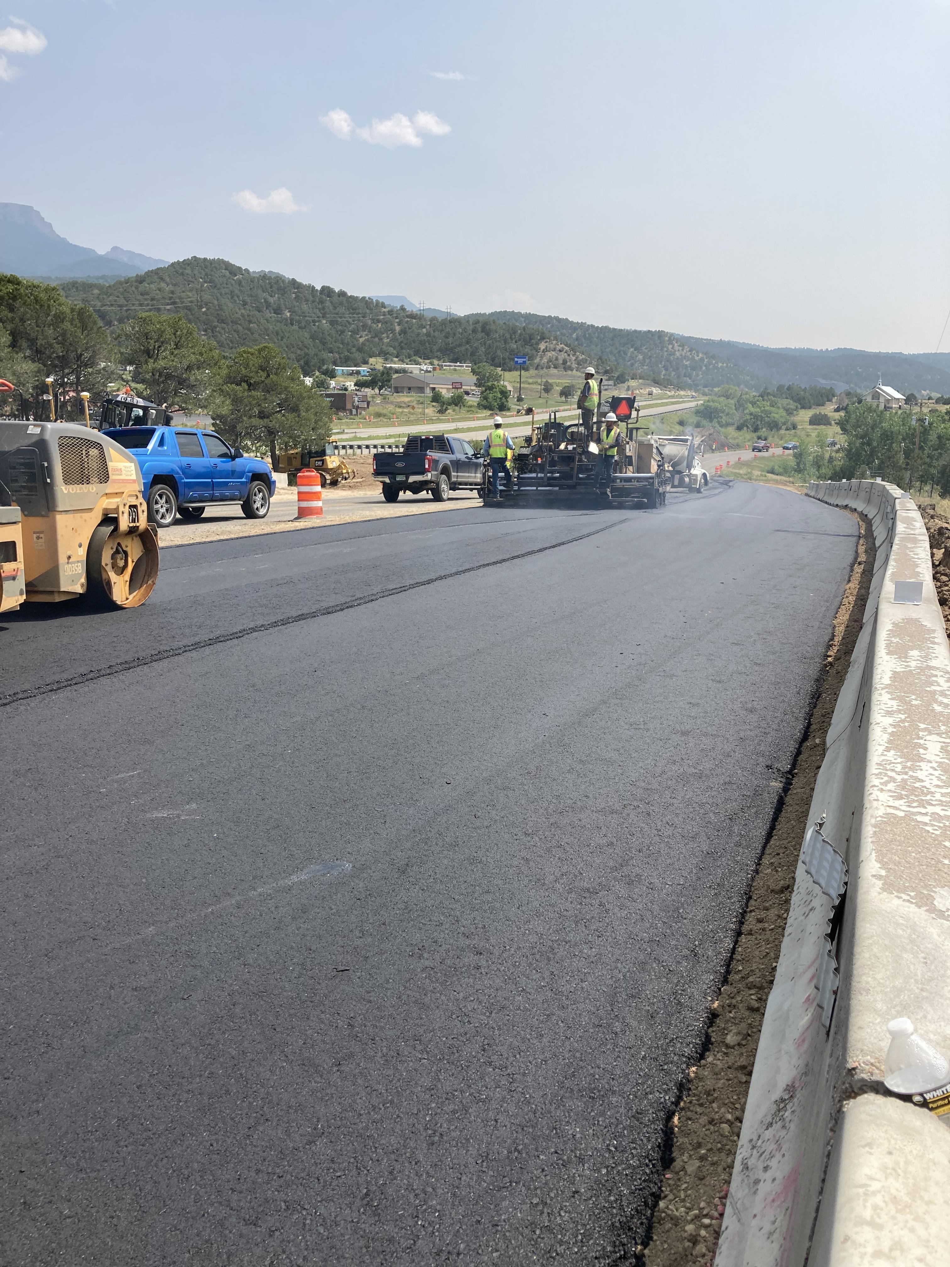 Crews applying asphalt pavement to new detour route to access SB I-25 from Exit 11 (1).JPG detail image