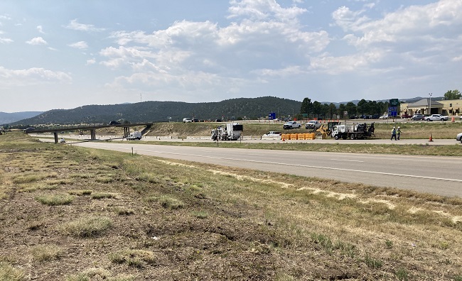Crews erecting barrier and striping SB I-25 at Exit 11.jpg detail image