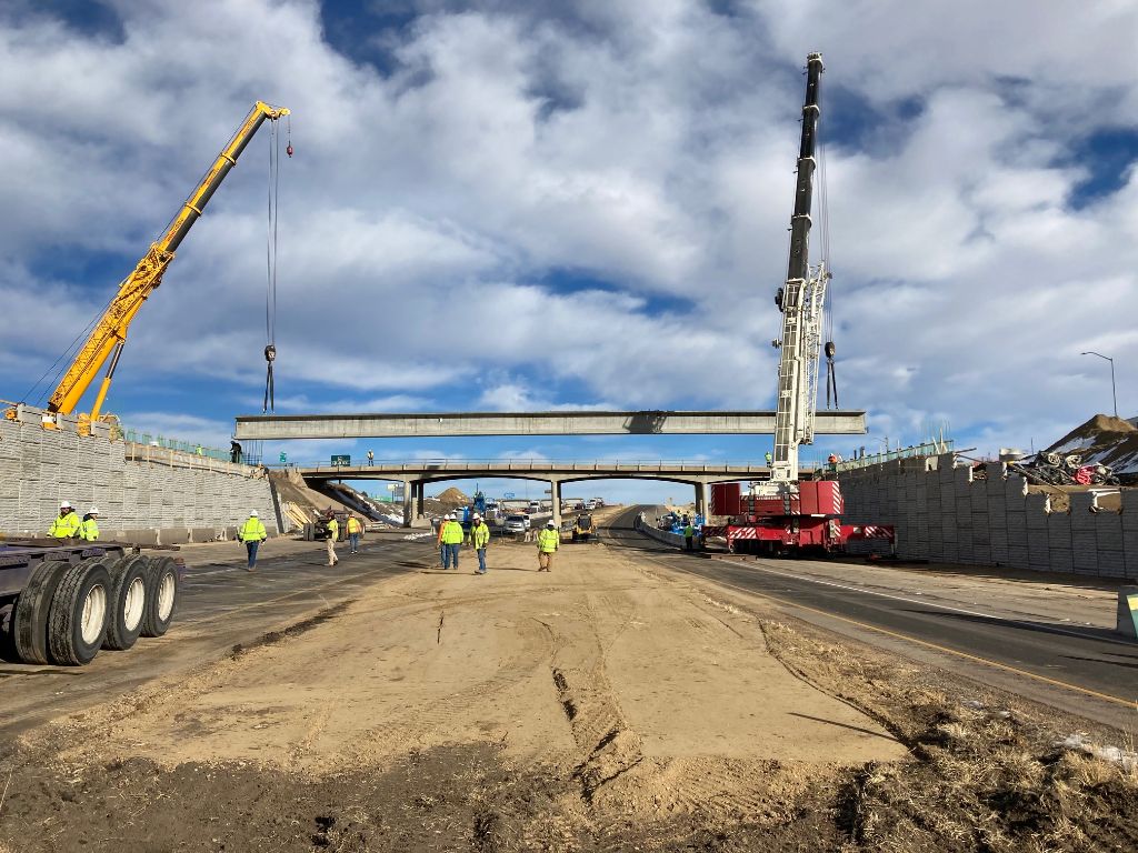 Crews placing first girder new bridge over I25 at Exit 11.jpg detail image