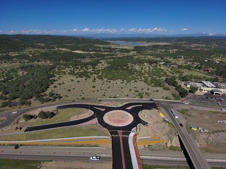 Drone view of newly constructed bridge and west roundabout with Trinidad Lake in the background. Photo Philip Hull
