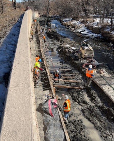 Crews armoring the wall along Clear Creek. Photo Ricky Esparza