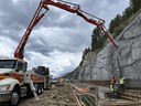 I-70 Floyd Hill Truck Pumping Concrete for Super Ditch and Shotcrete Spraying and Sculpting in Background.jpg thumbnail image