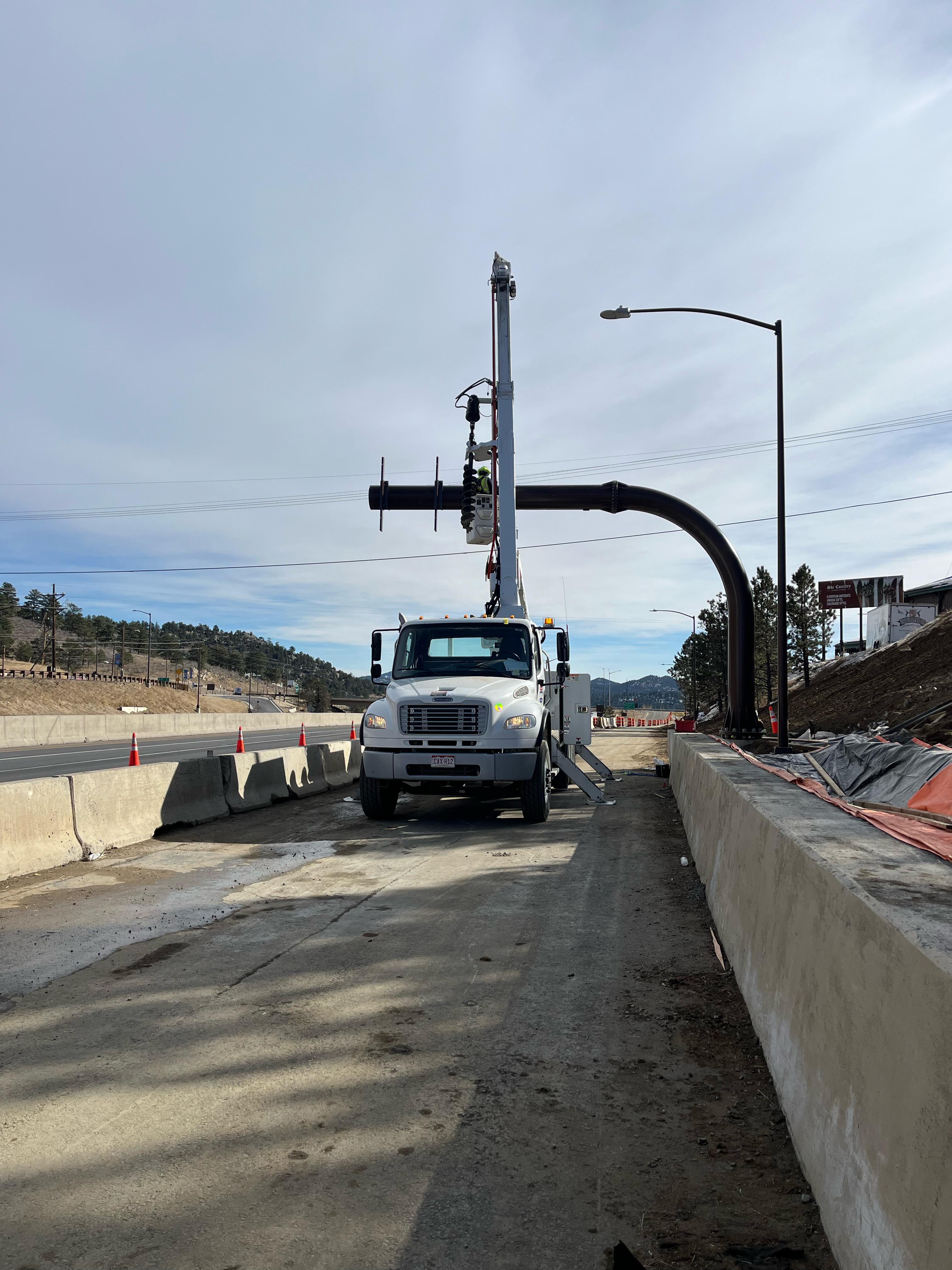 Crews installing signage I-70 Floyd Hill Project detail image