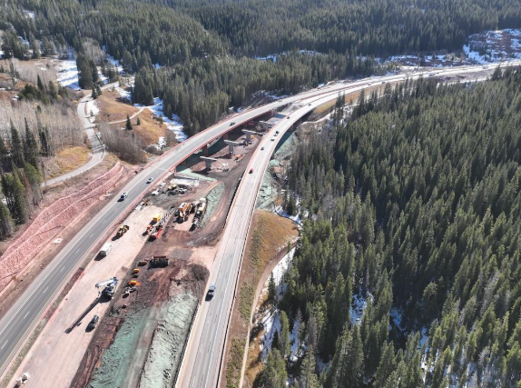 Aerial view looking east over the I-70 bridges at Mile Point 185. The westbound bridge is seen on the left with the foundation, columns and piers for the future eastbound bridge immediately beside it.