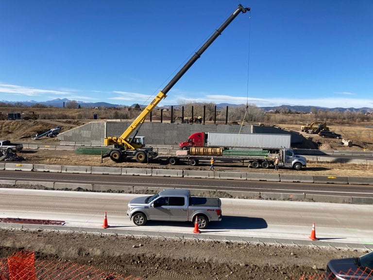 Side view of construction crews working on I-25 North 