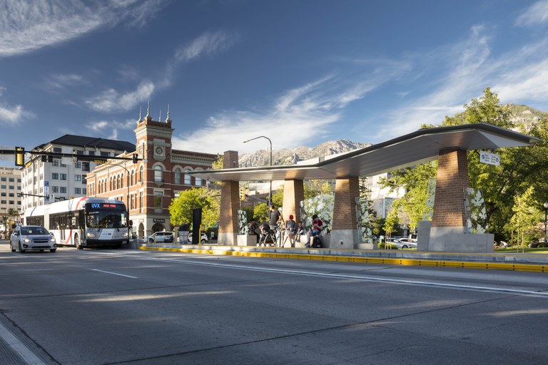 Bus rapid transit shelter in Provo, Utah. Amenities displayed at the shelter include a canopy, accessible bus entryways and seating, a map case, and space for art opportunities.