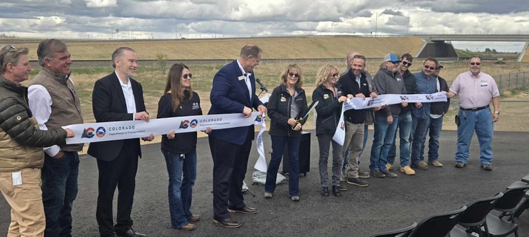 CDOT team cut the ribbon at the US 85 and Weld County Road 44 Interchange completion celebration.