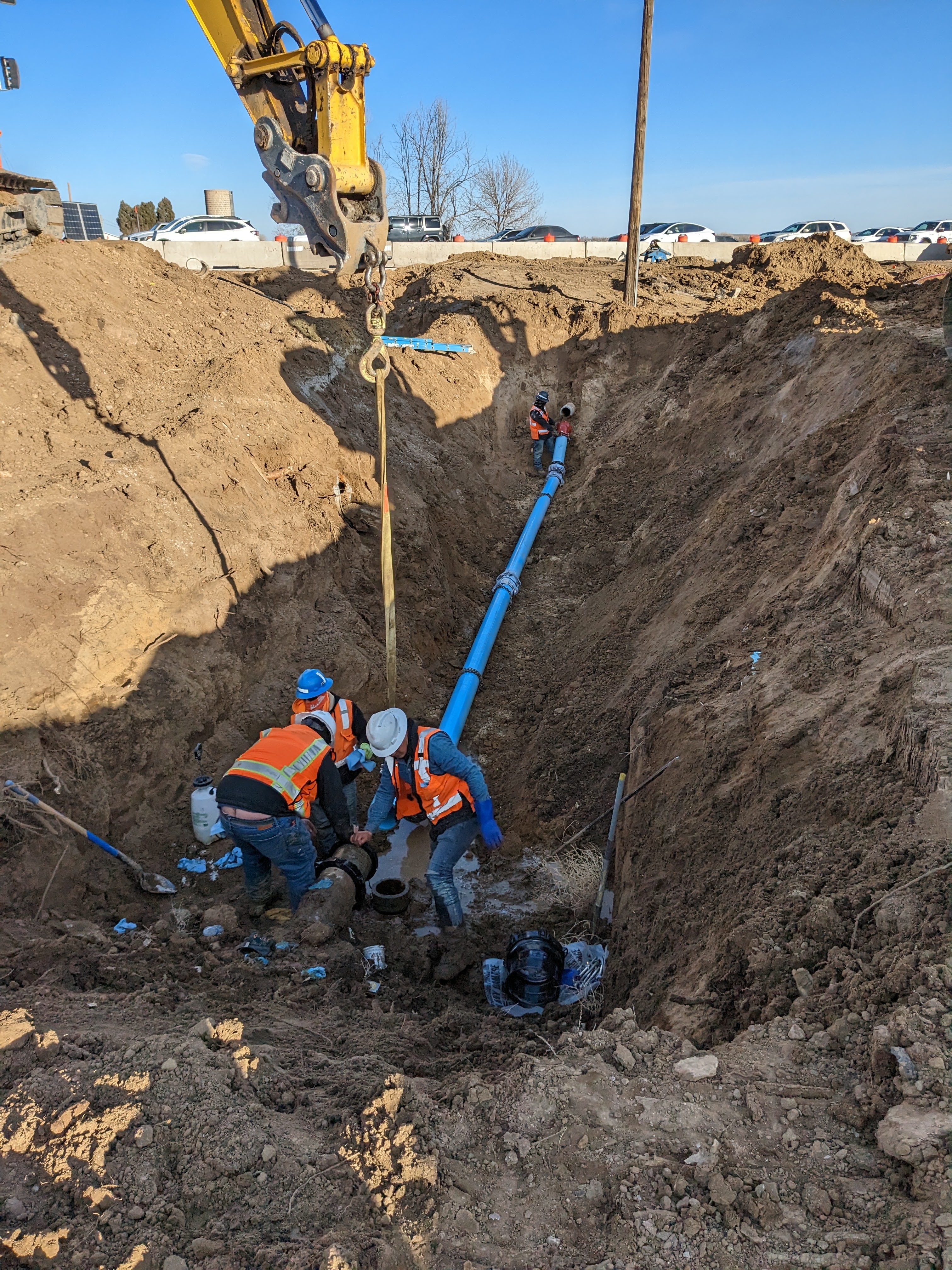 Crews installing new irrigation pipe at the south end of the intersection. Photo Tim Bricker