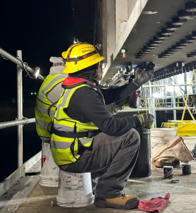 Crews installed nearly 200 bolts to hold each of the massive steel plates in place