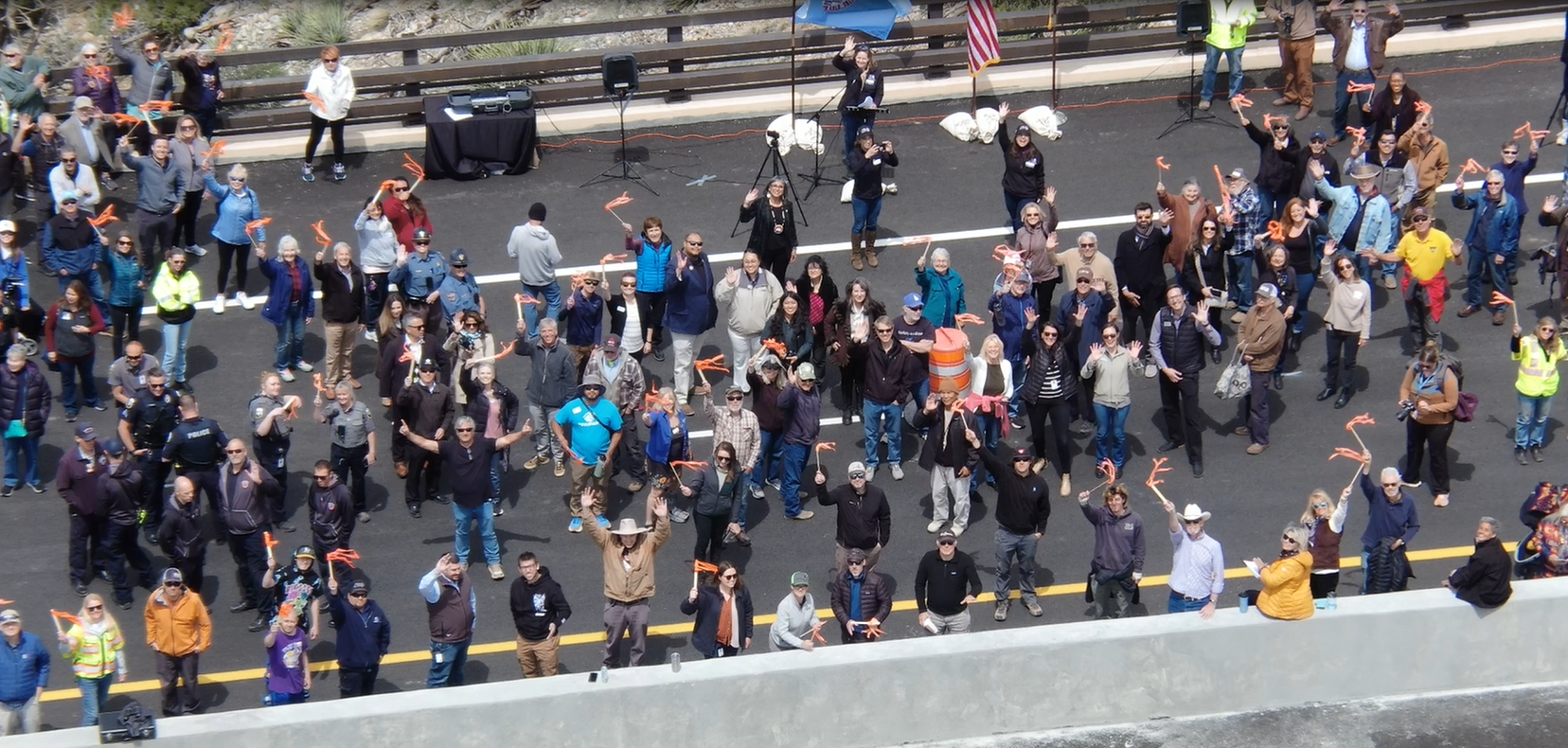 Drone footage of event attendees waving from US 550 Gulch A Bridge.png detail image
