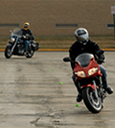 Riding instruction class with riders navigating cones thumbnail image