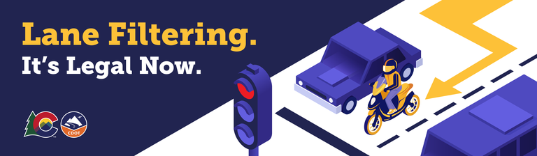 "Lane filtering - It's legal now" graphic showing a motorcyclist properly lane filtering at a stopped red light.
