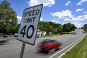 Car Speeding Past Speeding Limit Sign.jpeg thumbnail image