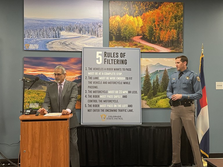 Glenn Davis, CDOT Highway Safety Office Manager and Chief Matthew Packard, Colorado State Patrol speaking at a press conference about motorcyle lane filtering
