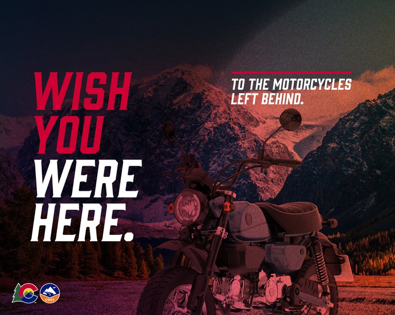 An image with a red tint of a motorcycle in front of a mountain landscape. Text on image reads: “Wish you were here. To the motorcycles left behind.